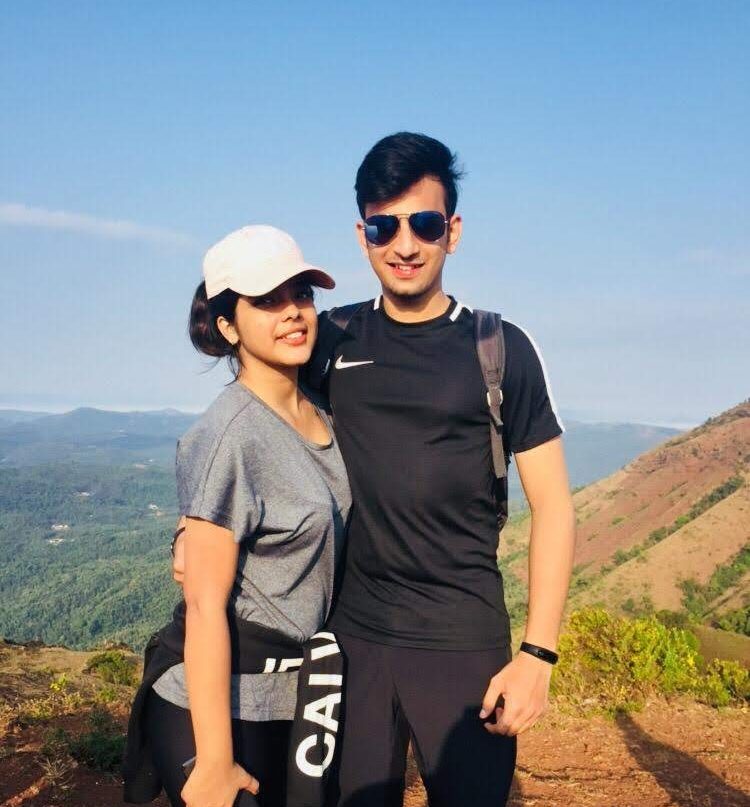 A Boy & Girl standing at Mullayangiri Peak in Chikmaglur