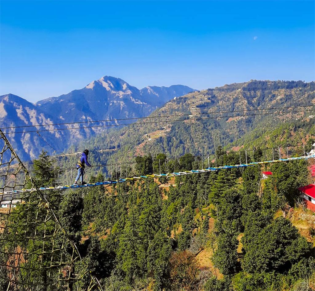 A girl crossing valley in Kanatal